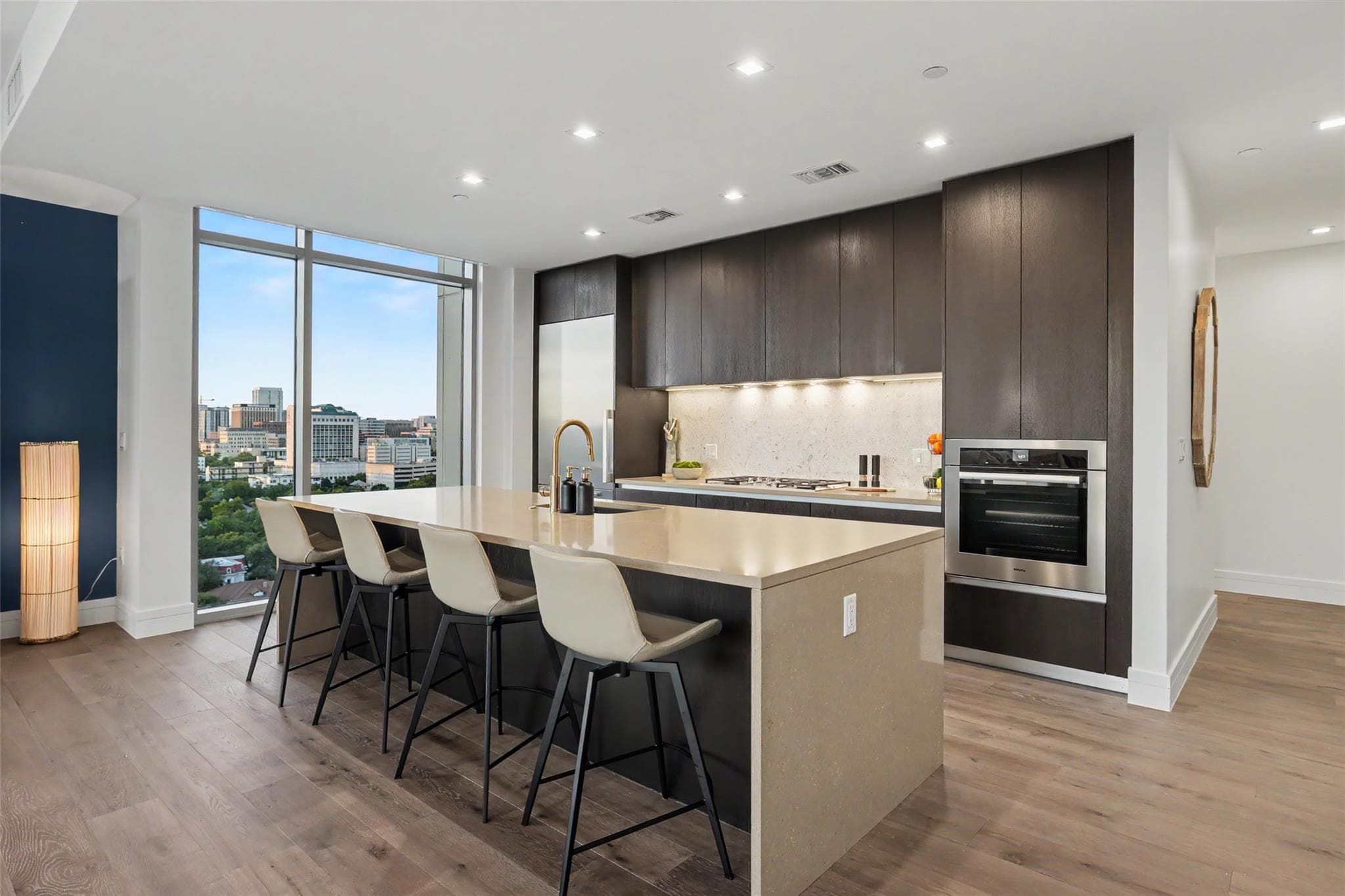 A sleek, contemporary kitchen with generous count