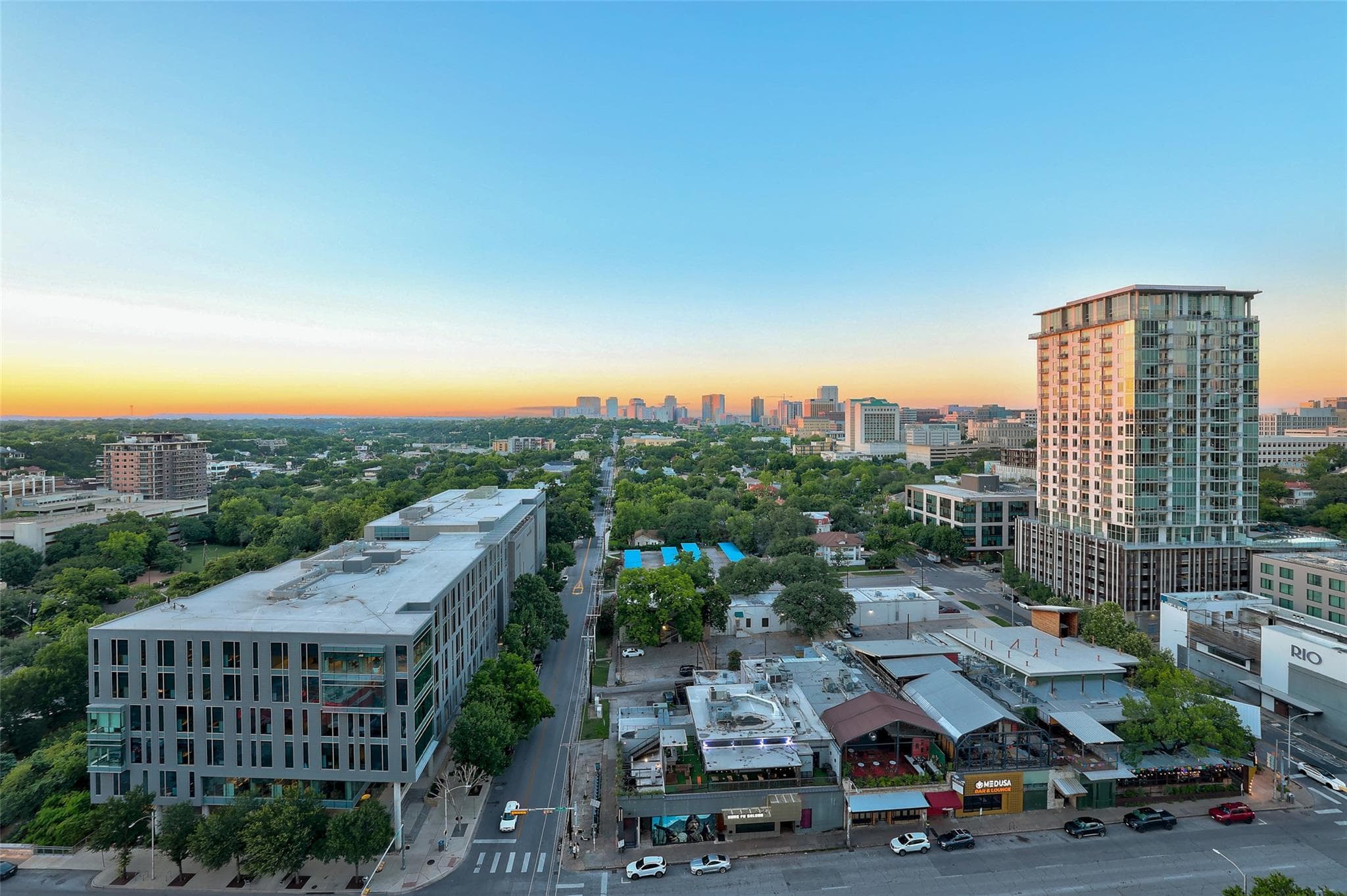 City skyline views unfold at sunset, offering a v