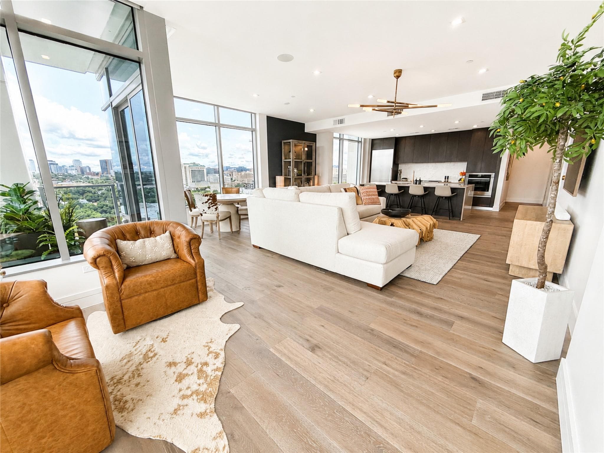 City views frame this modern open-concept living