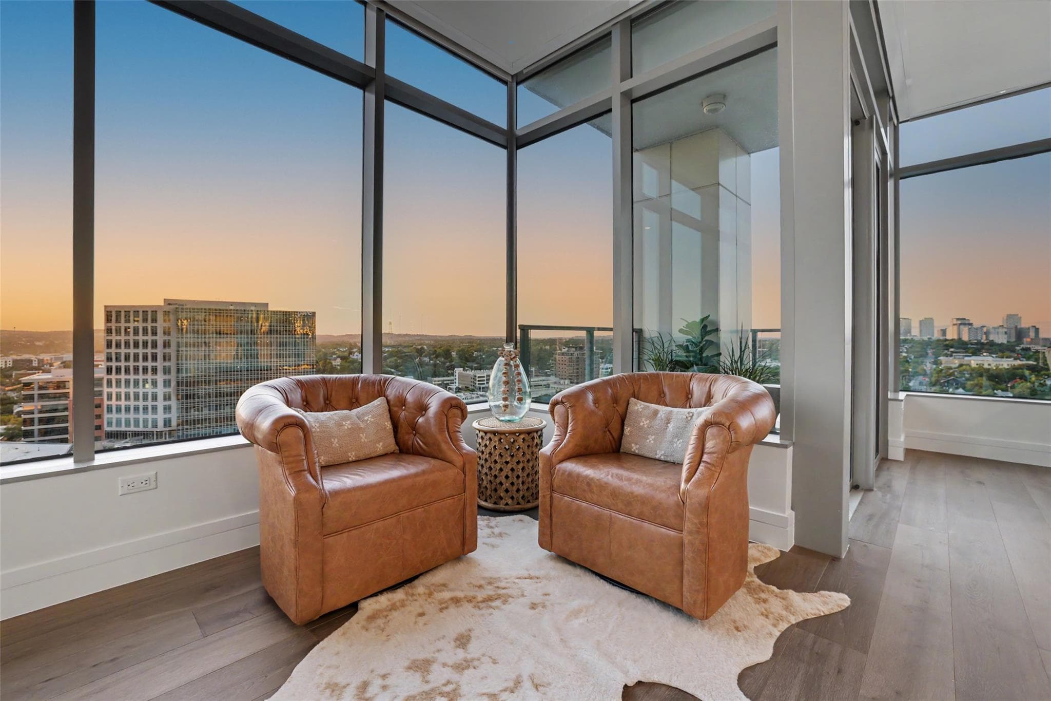 Floor-to-ceiling windows offer captivating city v