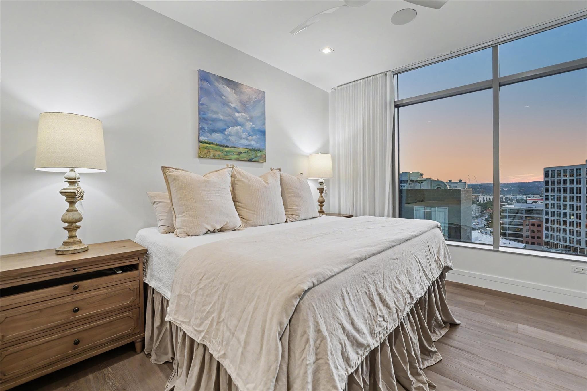 Floor-to-ceiling windows illuminate a spacious pr