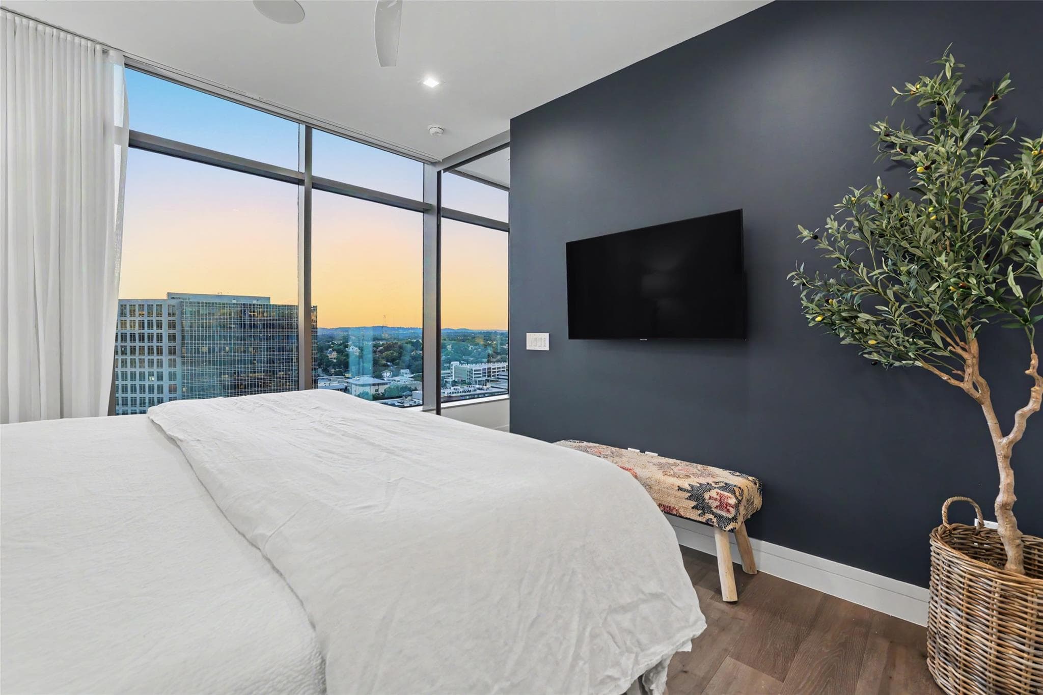 Floor-to-ceiling windows offer captivating citysc