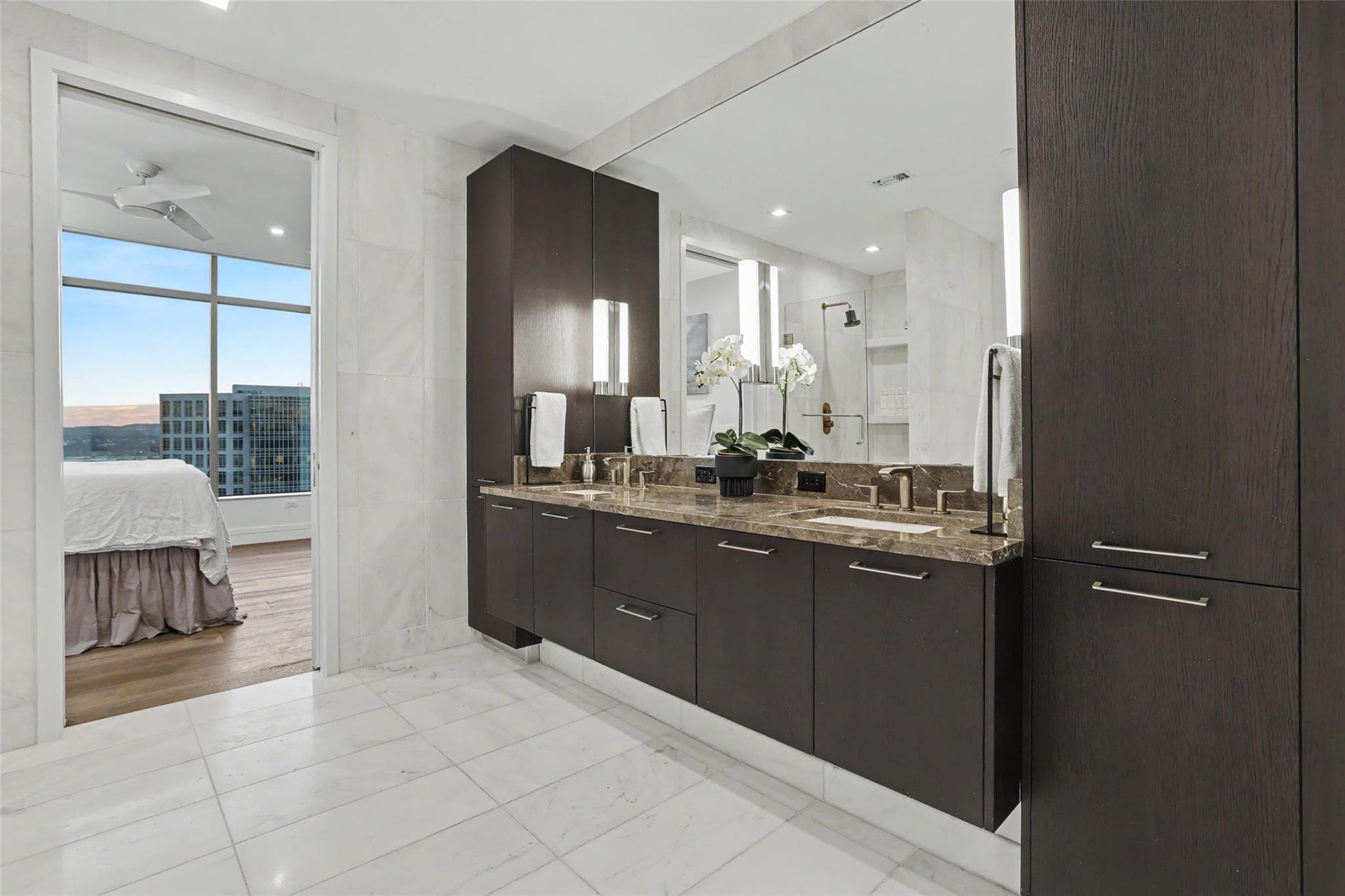 Double vanity with stone counters and modern fixt