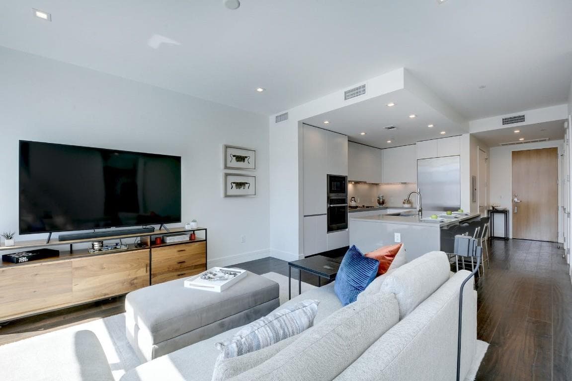 Living area featuring dark wood-style floors and