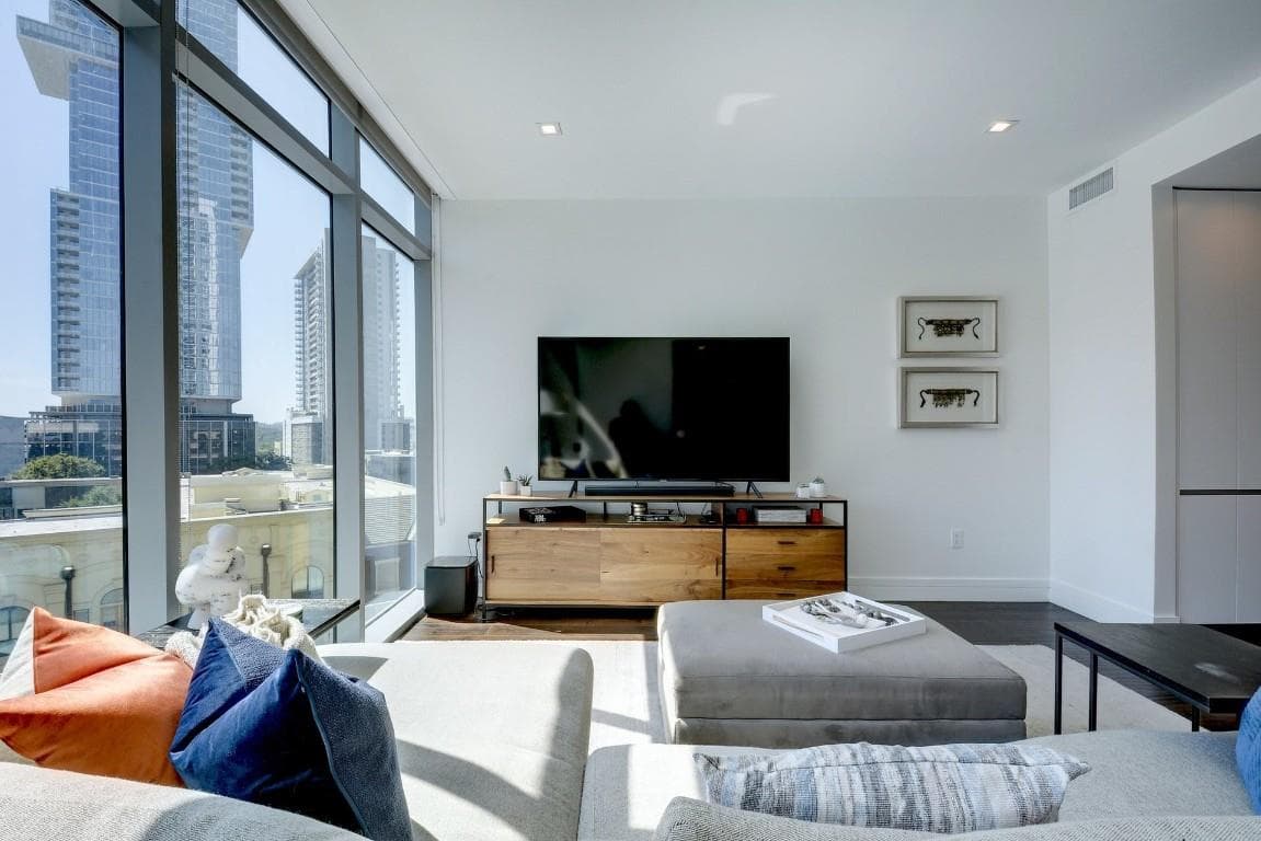Living room featuring expansive windows, recessed