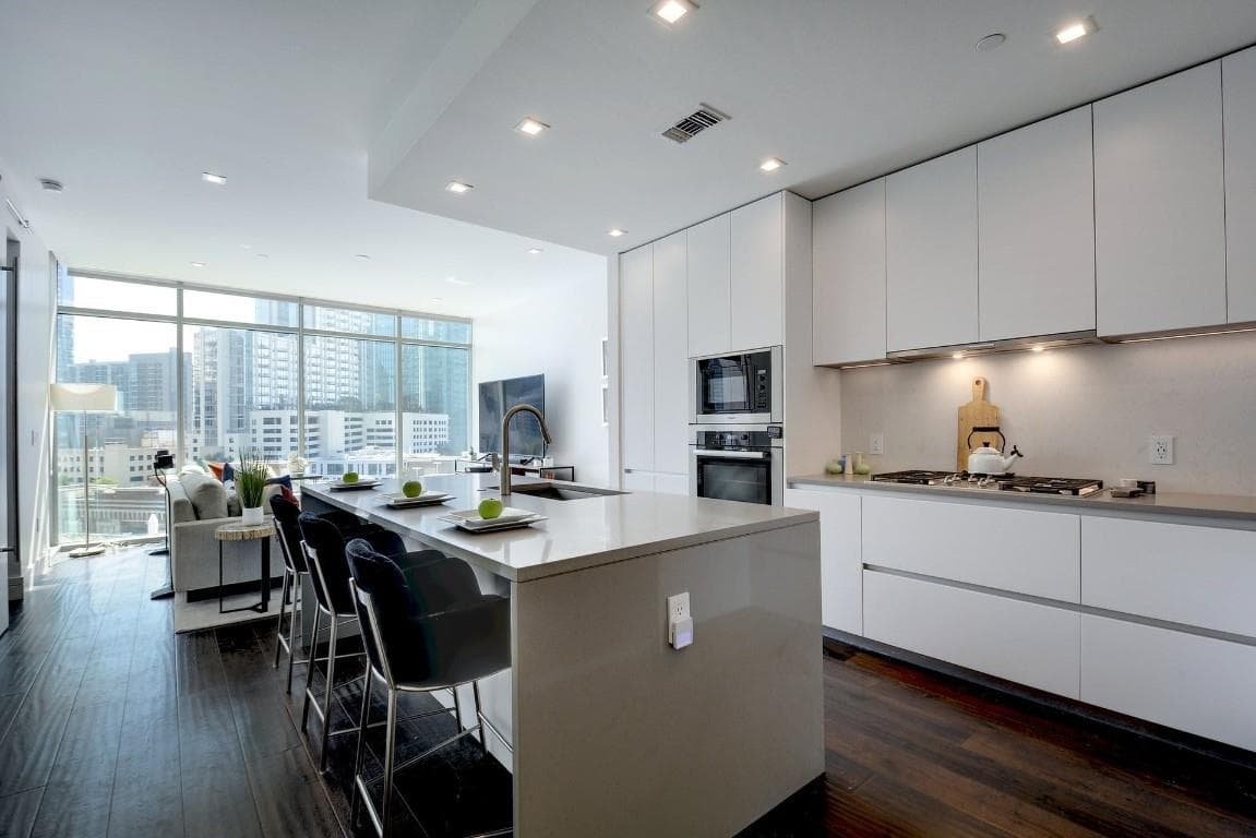 Kitchen featuring floor to ceiling windows, a kit