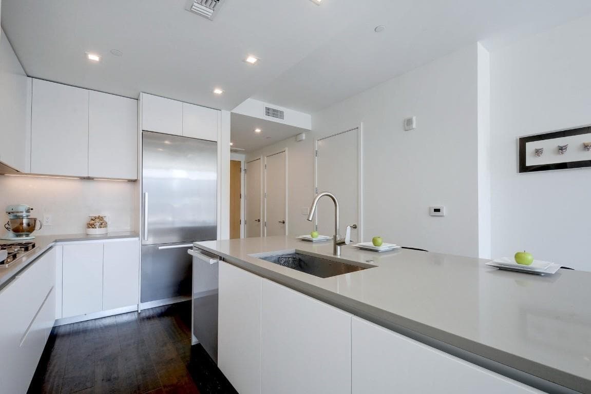 Kitchen with modern cabinets, white cabinetry, st