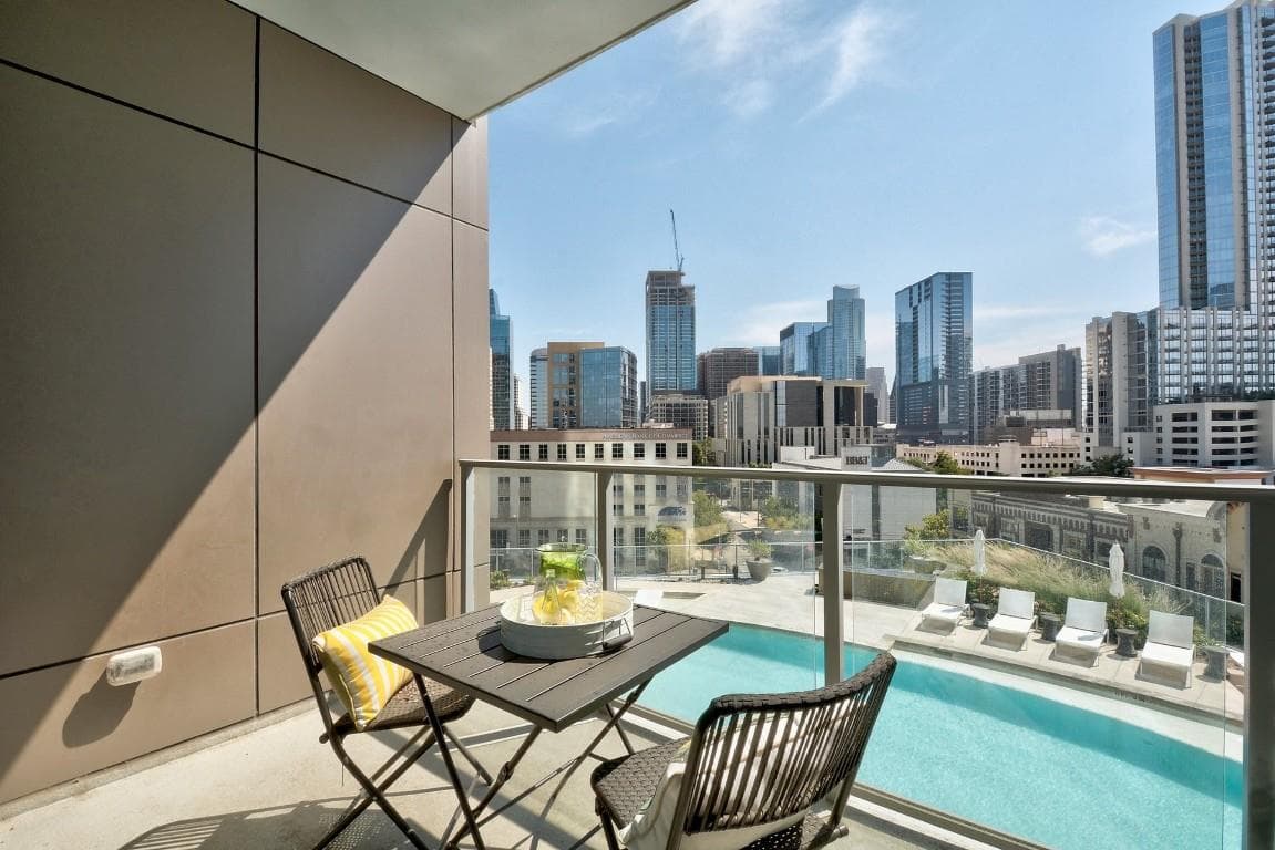 Balcony featuring view of pool area and a view of