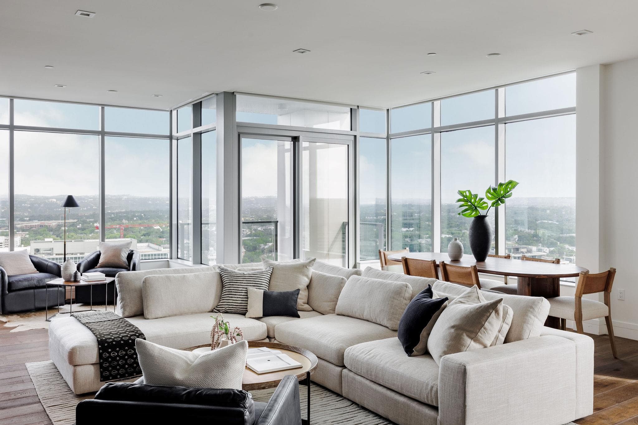 Floor-to-ceiling windows showcase an expansive ci