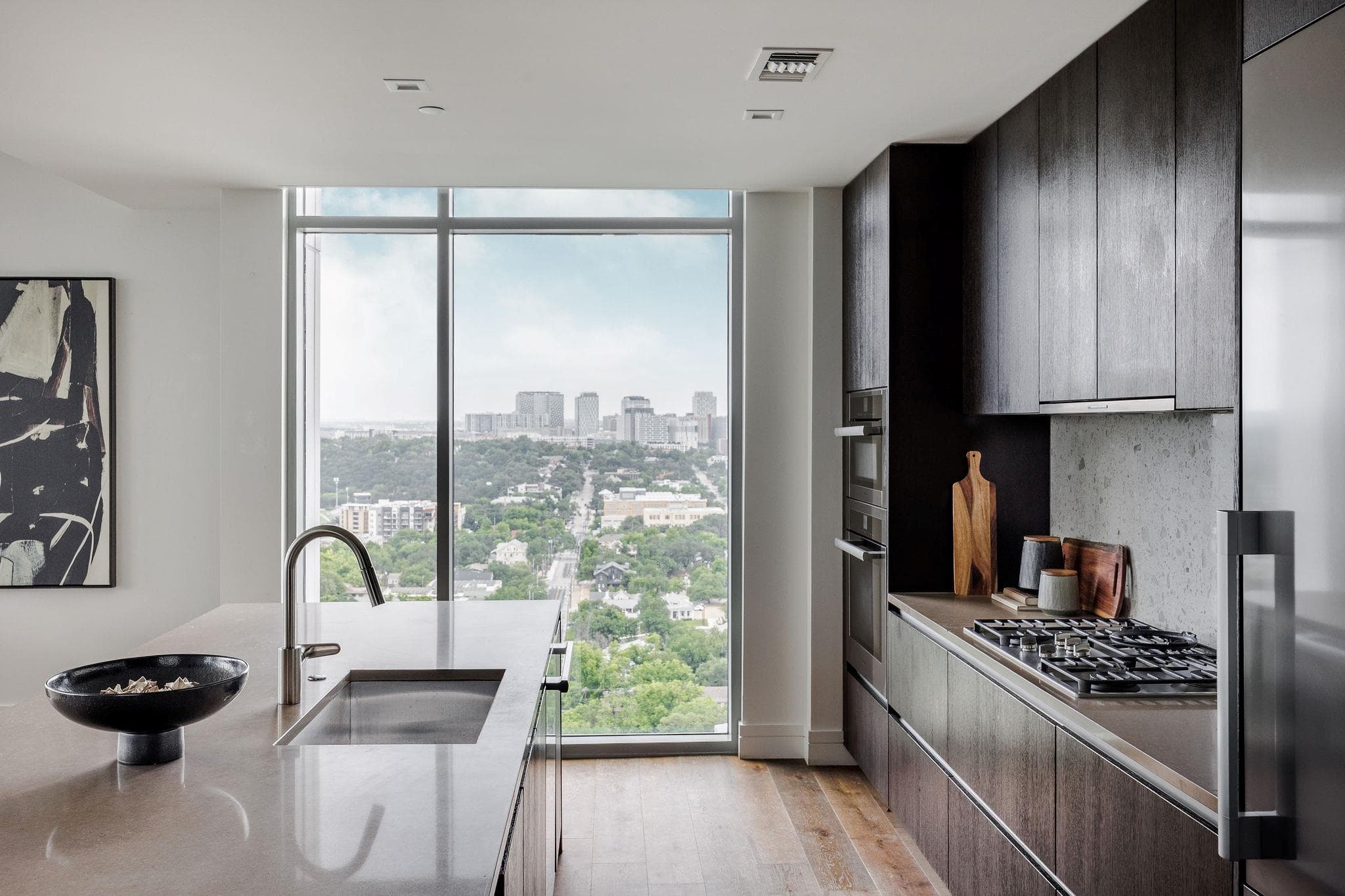 An urban panorama accompanies culinary creations
