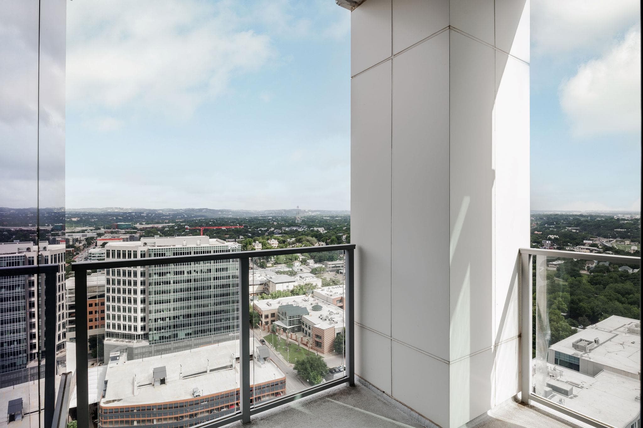 A spacious balcony offers sweeping views of the c