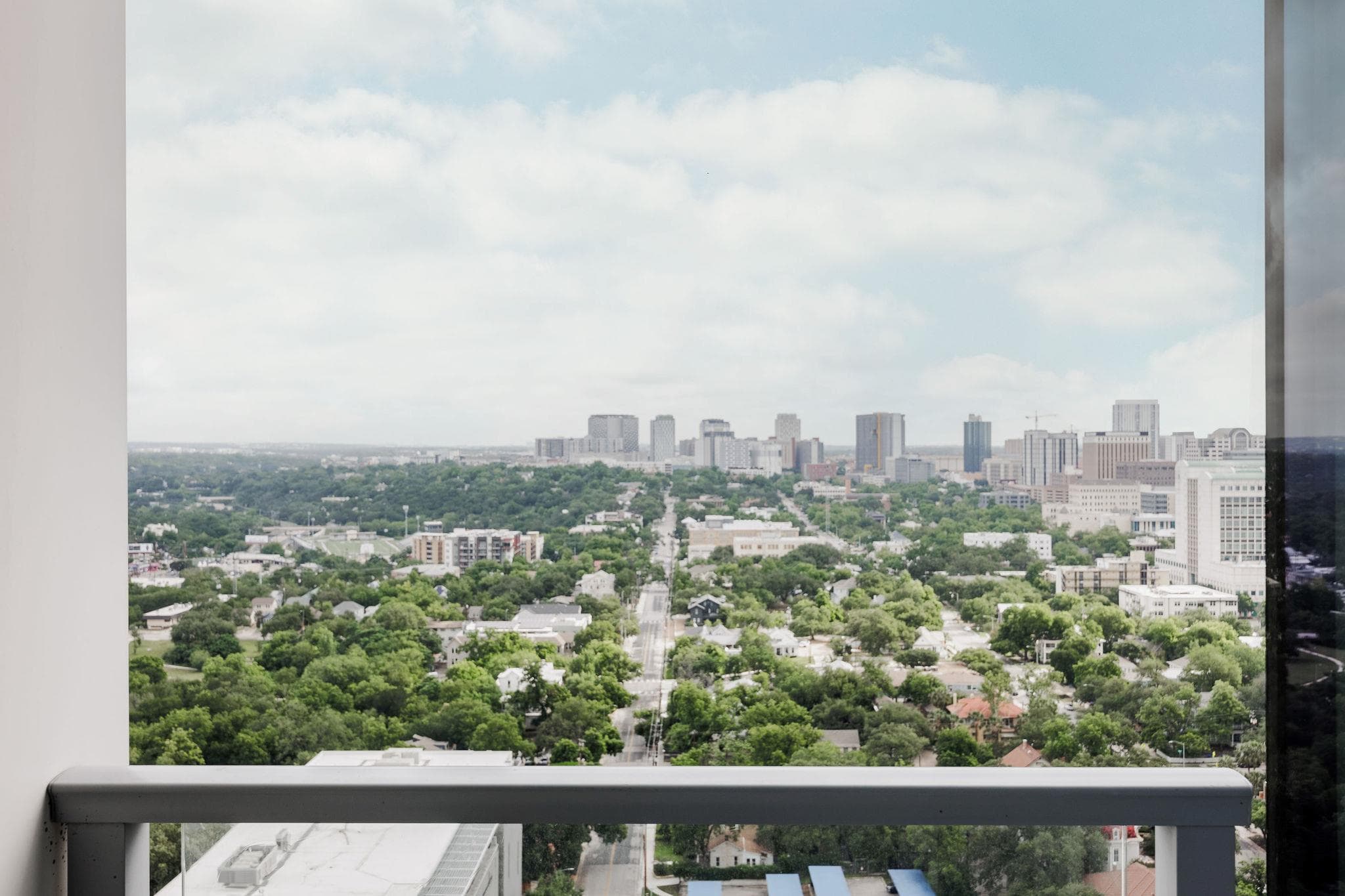 A commanding cityscape vista from a high-rise bal