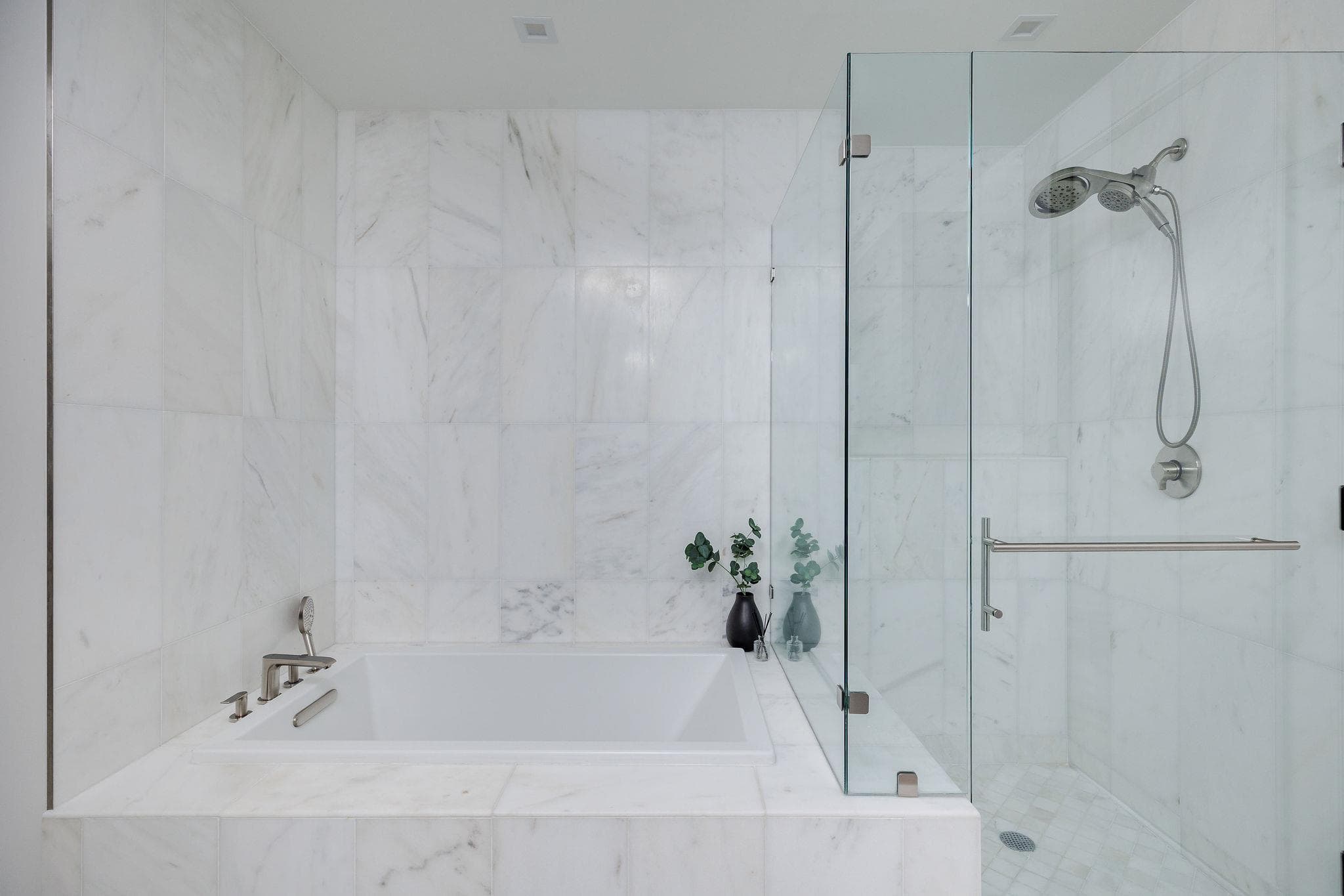 Marble-clad walls encase a tranquil soaking tub a