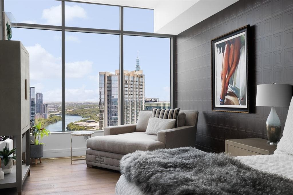 Living area with skyline and river views at Fifth & West
